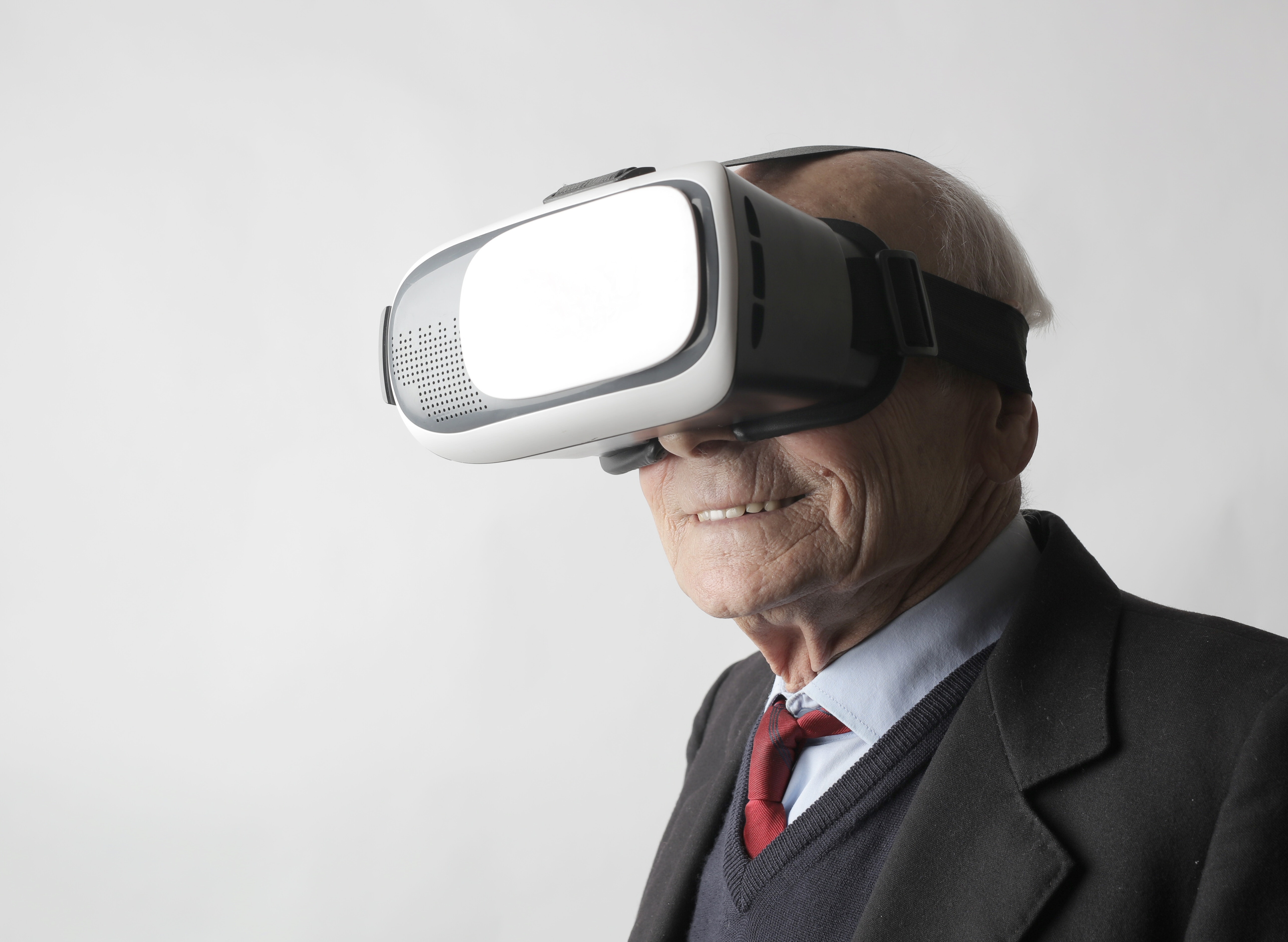 Old man wearing a VR goggle